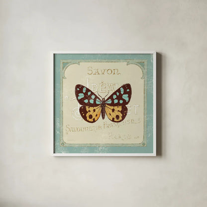 Parisian Butterfly I by Sue Schlabach. Shown in a crisp white glass frame for a clean and minimalist style. Available as an archival giclee rolled canvas, fine art paper, or poster print. SKU 9077a.