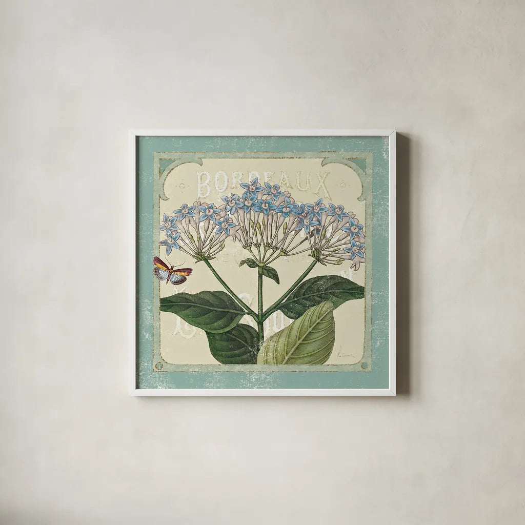 Parisian Flowers I by Sue Schlabach. Shown in a crisp white glass frame for a clean and minimalist style. Available as an archival giclee rolled canvas, fine art paper, or poster print. SKU 9079a.