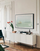 Sailing on the Bay by Sue Schlabach. shown as a framed stretched canvas in a living room above a console. Available as a archival giclee rolled canvas, fine art paper, or poster print. SKU 47304i.