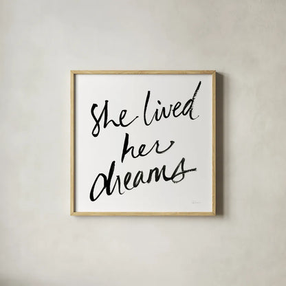 She Lived Her Dreams by Sue Schlabach. Shown in a natural wood glass frame for a timeless modern aesthetic. Available as an archival giclee rolled canvas, fine art paper, or poster print. SKU 48128a.