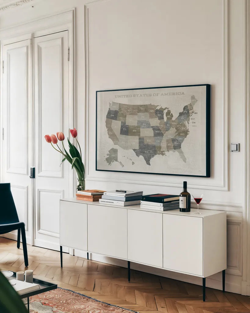 Slate US Map by Sue Schlabach. shown as a framed stretched canvas in a living room above a console. Available as a archival giclee rolled canvas, fine art paper, or poster print. SKU 57293i.