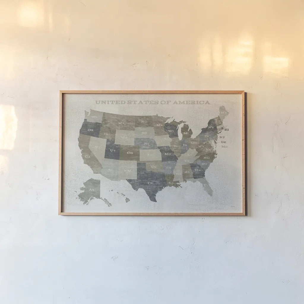 Slate US Map by Sue Schlabach. shown as a paper print in a natural frame. Available as a archival giclee rolled canvas, fine art paper, or poster print. SKU 57293i.