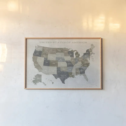 Slate US Map by Sue Schlabach. shown as a paper print in a natural frame. Available as a archival giclee rolled canvas, fine art paper, or poster print. SKU 57293i.