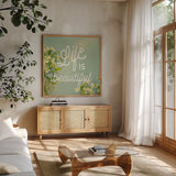 Spring Beauty I Square by Sue Schlabach. Shown in a natural wood frame in a cozy modern living room. Available as an archival giclee rolled canvas, fine art paper, or poster print. SKU 21684a.
