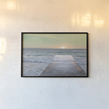 Sunrise Dock by Sue Schlabach. shown as a paper print in a black flame. Available as a archival giclee rolled canvas, fine art paper, or poster print. SKU 18852i.