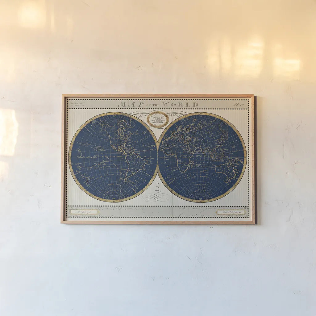 Torkingtons World Map Indigo Globes by Sue Schlabach. shown as a paper print in a natural frame. Available as a archival giclee rolled canvas, fine art paper, or poster print. SKU 44846i.