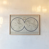 Torkingtons World Map with Indigo by Sue Schlabach. shown as a paper print in a natural frame. Available as a archival giclee rolled canvas, fine art paper, or poster print. SKU 44845i.