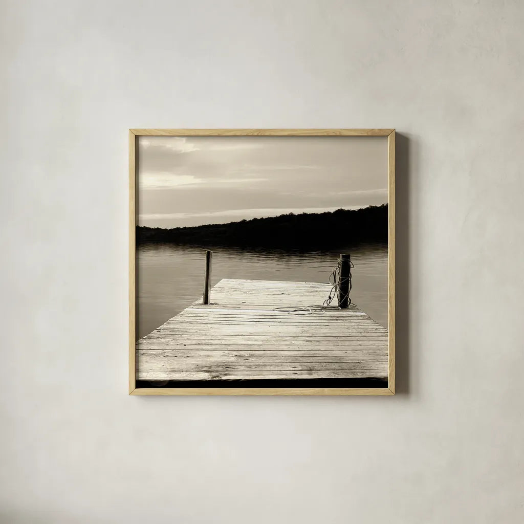 Twilight Dock III Sepia by Sue Schlabach. Shown in a natural wood glass frame for a timeless modern aesthetic. Available as an archival giclee rolled canvas, fine art paper, or poster print. SKU 11292a.
