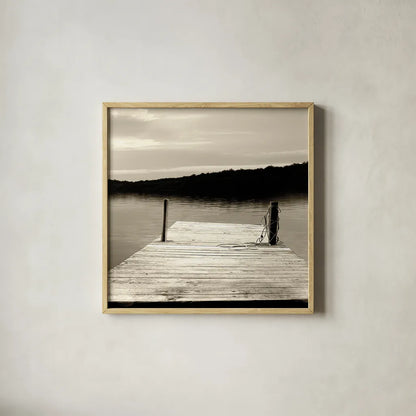 Twilight Dock III Sepia by Sue Schlabach. Shown in a natural wood glass frame for a timeless modern aesthetic. Available as an archival giclee rolled canvas, fine art paper, or poster print. SKU 11292a.