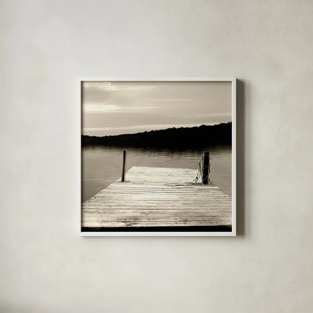 Twilight Dock III Sepia by Sue Schlabach. Shown in a crisp white glass frame for a clean and minimalist style. Available as an archival giclee rolled canvas, fine art paper, or poster print. SKU 11292a.