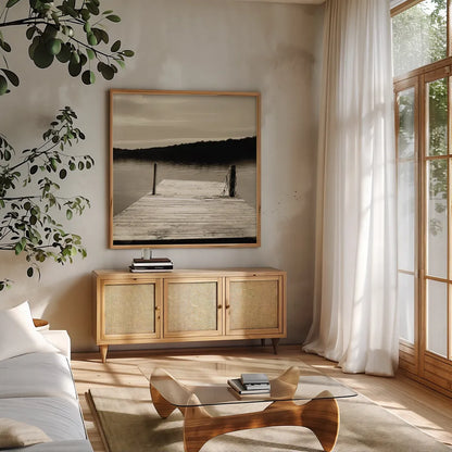 Twilight Dock III Sepia by Sue Schlabach. Shown in a natural wood frame in a cozy modern living room. Available as an archival giclee rolled canvas, fine art paper, or poster print. SKU 11292a.