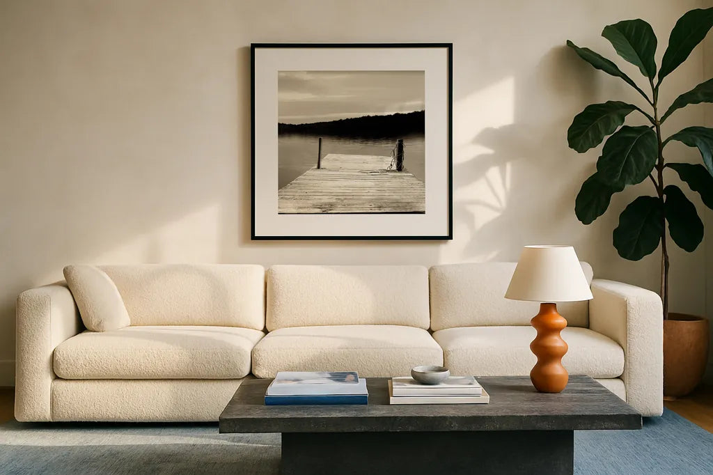 Twilight Dock III Sepia by Sue Schlabach. Displayed in a glass frame with matte in a clean modern living room. Available as an archival giclee rolled canvas, fine art paper, or poster print. SKU 11292a.