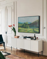 View of the Valley by Sue Schlabach. shown as a framed stretched canvas in a living room above a console. Available as a archival giclee rolled canvas, fine art paper, or poster print. SKU 84230i.