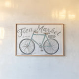 White Barn Flea Market I by Sue Schlabach. shown as a paper print in a natural frame. Available as a archival giclee rolled canvas, fine art paper, or poster print. SKU 31765i.