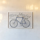 White Barn Flea Market I Blue Gray by Sue Schlabach. shown as a paper print in a white frame. Available as a archival giclee rolled canvas, fine art paper, or poster print. SKU 56465i.