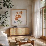 White Barn Flowers VII Sq by Sue Schlabach. Shown in a natural wood frame in a cozy modern living room. Available as an archival giclee rolled canvas, fine art paper, or poster print. SKU 56517a.