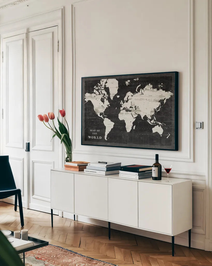 World Map Black by Sue Schlabach. shown as a framed stretched canvas in a living room above a console. Available as a archival giclee rolled canvas, fine art paper, or poster print. SKU 60389i.