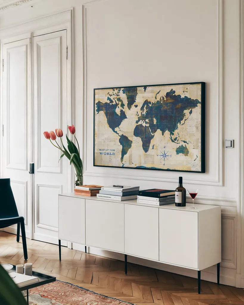 World Map Collage by Sue Schlabach. shown as a framed stretched canvas in a living room above a console. Available as a archival giclee rolled canvas, fine art paper, or poster print. SKU 25667i.