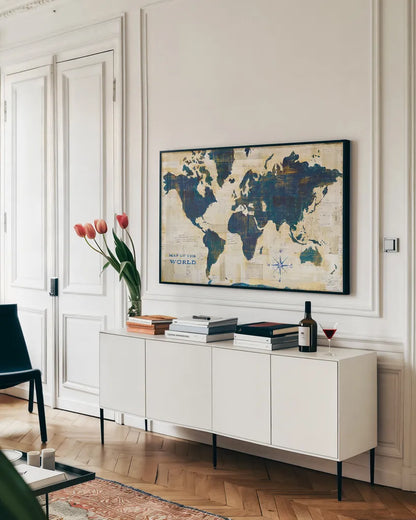 World Map Collage by Sue Schlabach. shown as a framed stretched canvas in a living room above a console. Available as a archival giclee rolled canvas, fine art paper, or poster print. SKU 25667i.