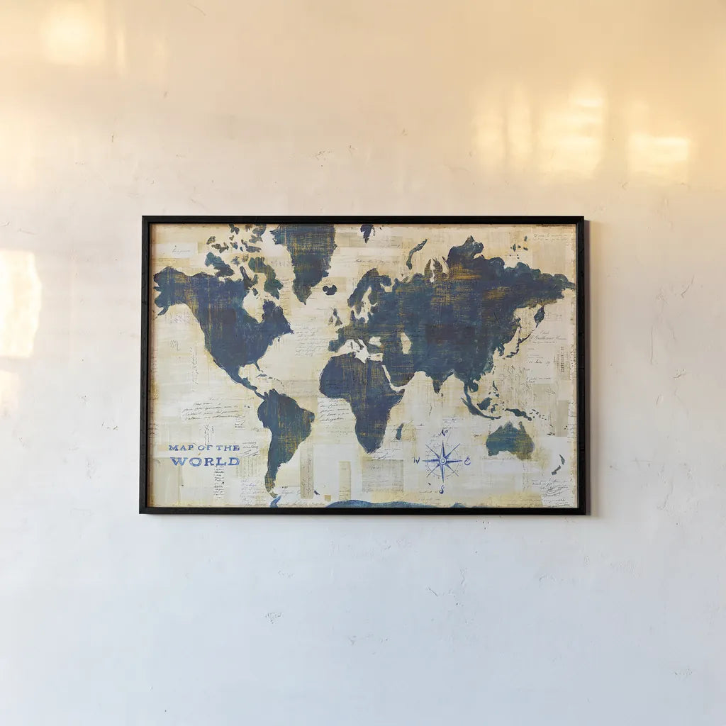 World Map Collage by Sue Schlabach. shown as a paper print in a black flame. Available as a archival giclee rolled canvas, fine art paper, or poster print. SKU 25667i.