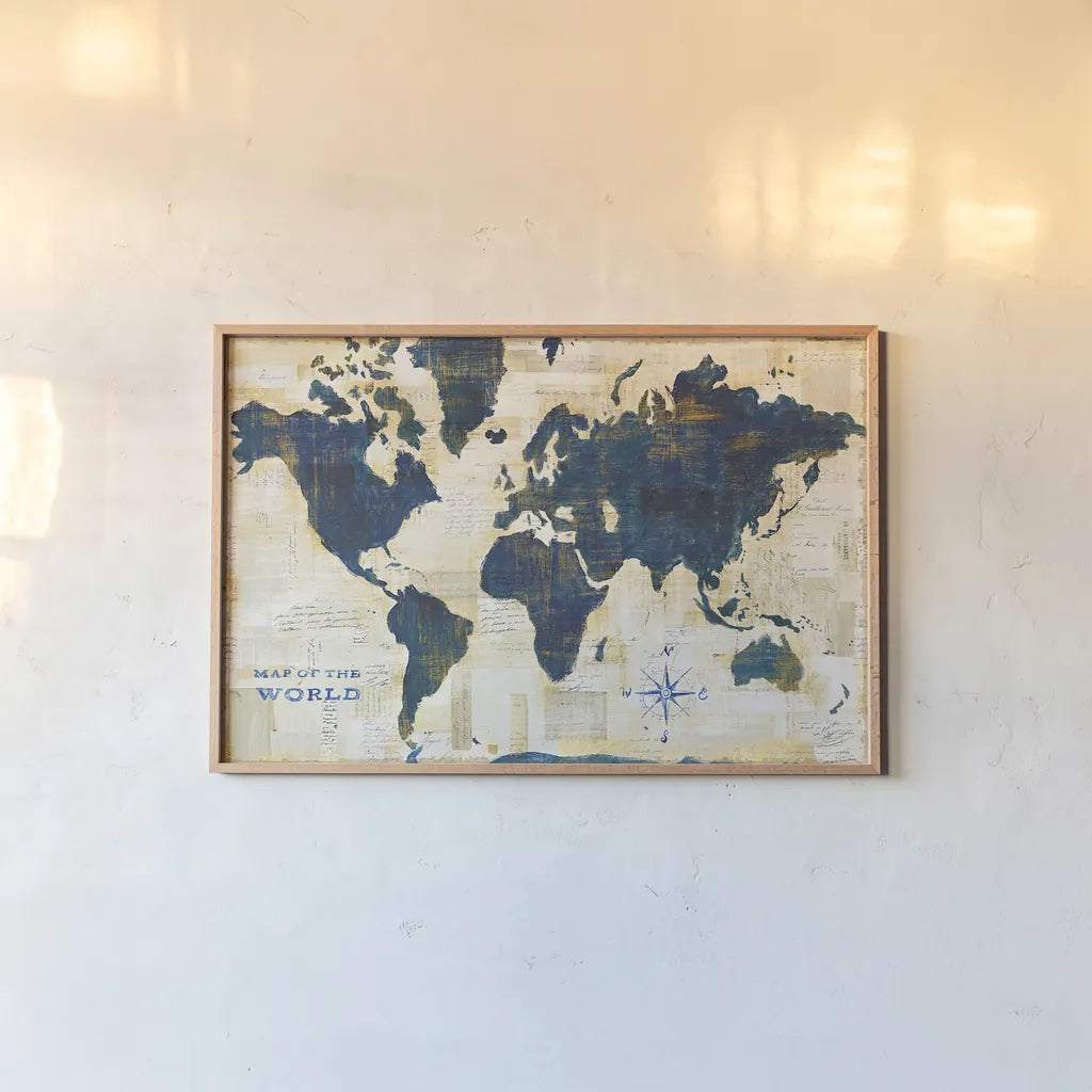World Map Collage by Sue Schlabach. shown as a paper print in a natural frame. Available as a archival giclee rolled canvas, fine art paper, or poster print. SKU 25667i.