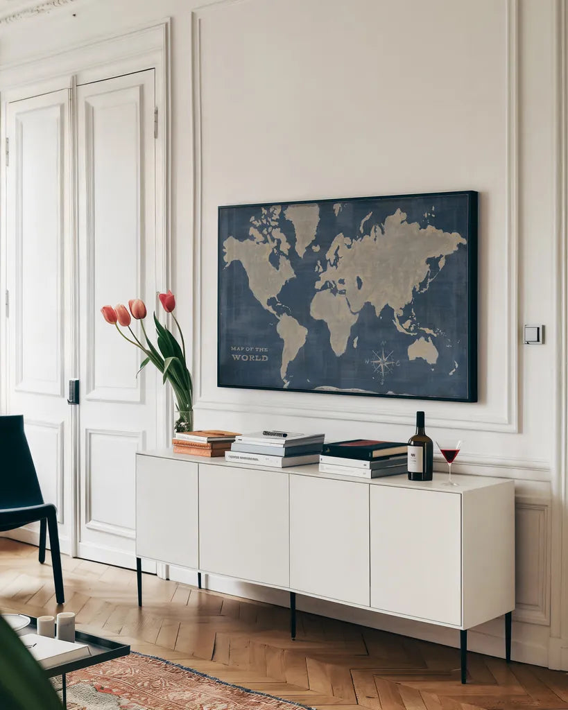 World Map Collage Deep by Sue Schlabach. shown as a framed stretched canvas in a living room above a console. Available as a archival giclee rolled canvas, fine art paper, or poster print. SKU 75338i.