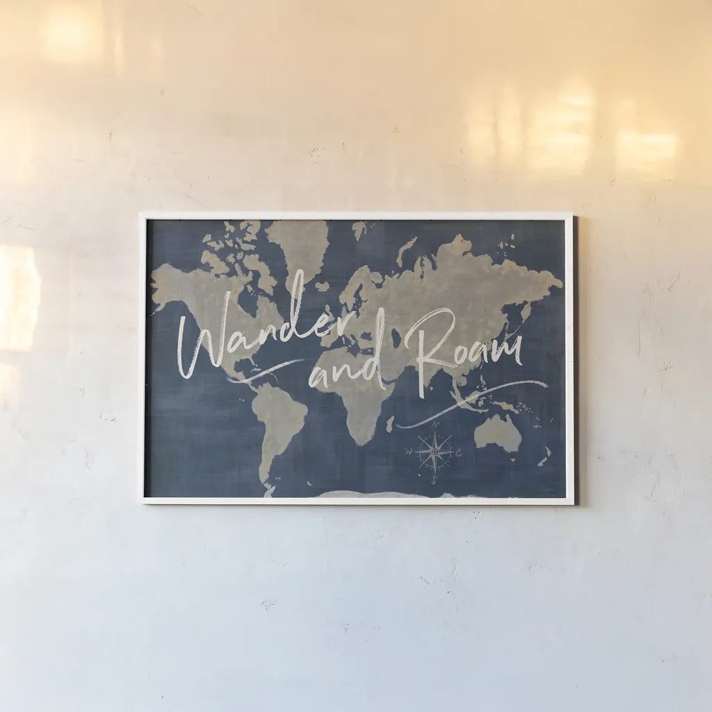 World Map Collage Deep Wander by Sue Schlabach. shown as a paper print in a white frame. Available as a archival giclee rolled canvas, fine art paper, or poster print. SKU 75339i.