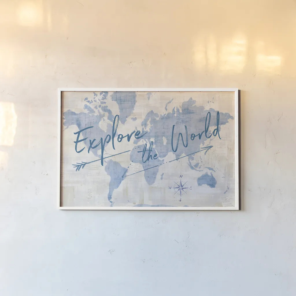 World Map Collage Explore by Sue Schlabach. shown as a paper print in a white frame. Available as a archival giclee rolled canvas, fine art paper, or poster print. SKU 75340i.