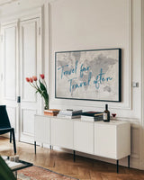 World Map Collage Travel by Sue Schlabach. shown as a framed stretched canvas in a living room above a console. Available as a archival giclee rolled canvas, fine art paper, or poster print. SKU 75341i.