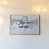 World Map White and Blue Adventure by Sue Schlabach. shown as a paper print in a natural frame. Available as a archival giclee rolled canvas, fine art paper, or poster print. SKU 51898i.