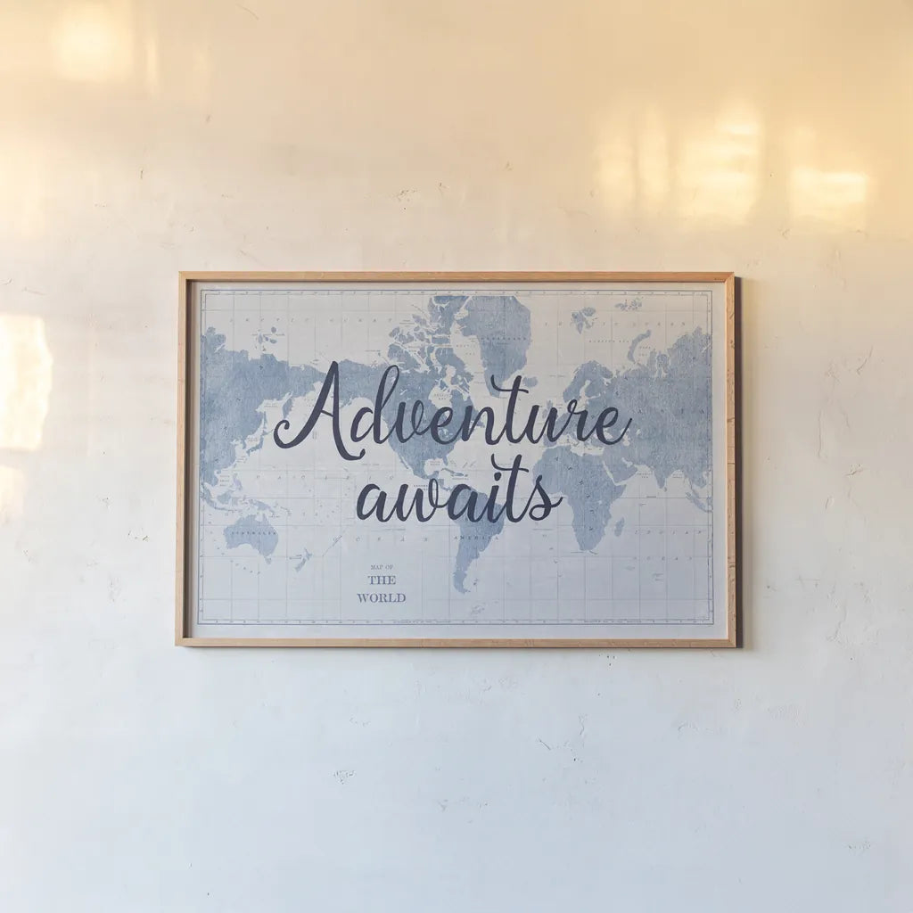 World Map White and Blue Adventure by Sue Schlabach. shown as a paper print in a natural frame. Available as a archival giclee rolled canvas, fine art paper, or poster print. SKU 51898i.