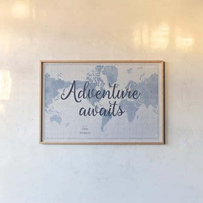 World Map White and Blue Adventure by Sue Schlabach. shown as a paper print in a natural frame. Available as a archival giclee rolled canvas, fine art paper, or poster print. SKU 51898i.