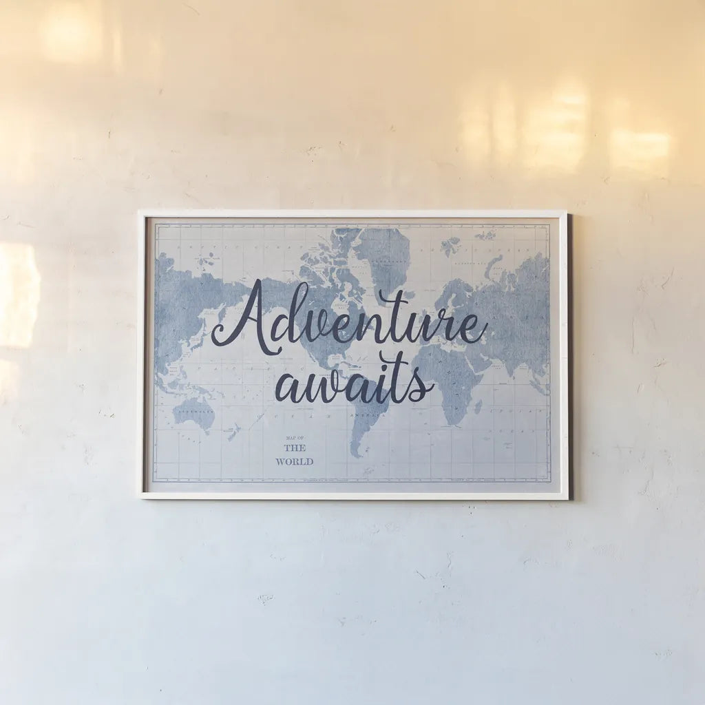 World Map White and Blue Adventure by Sue Schlabach. shown as a paper print in a white frame. Available as a archival giclee rolled canvas, fine art paper, or poster print. SKU 51898i.