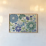 Blue Garden by Veronique Charron. shown as a paper print in a natural frame. Available as a archival giclee rolled canvas, fine art paper, or poster print. SKU 11846i.