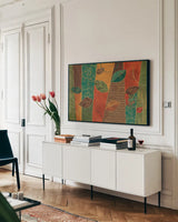 Bohemian Leaves I by Veronique Charron. shown as a framed stretched canvas in a living room above a console. Available as a archival giclee rolled canvas, fine art paper, or poster print. SKU 28891i.