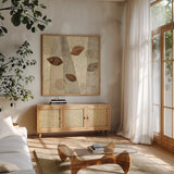 Bohemian Leaves II Neutral by Veronique Charron. Shown in a natural wood frame in a cozy modern living room. Available as an archival giclee rolled canvas, fine art paper, or poster print. SKU 28897a.