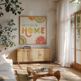 Citrus Splash VI by Veronique Charron. Shown in a natural wood frame in a cozy modern living room. Available as an archival giclee rolled canvas, fine art paper, or poster print. SKU 37558a.