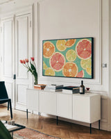 Citrus Splash XI by Veronique Charron. shown as a framed stretched canvas in a living room above a console. Available as a archival giclee rolled canvas, fine art paper, or poster print. SKU 38280i.