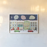 Hometown Holiday I by Veronique Charron. shown as a paper print in a white frame. Available as a archival giclee rolled canvas, fine art paper, or poster print. SKU 60896i.