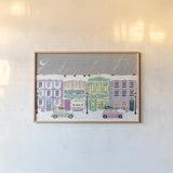 Hometown Holiday I Purple by Veronique Charron. shown as a paper print in a natural frame. Available as a archival giclee rolled canvas, fine art paper, or poster print. SKU 75402i.