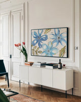Indigo Tones I by Veronique Charron. shown as a framed stretched canvas in a living room above a console. Available as a archival giclee rolled canvas, fine art paper, or poster print. SKU 84365i.