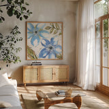Indigo Tones II by Veronique Charron. Shown in a natural wood frame in a cozy modern living room. Available as an archival giclee rolled canvas, fine art paper, or poster print. SKU 84366a.