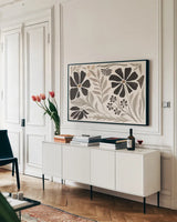 Modern Petals I Neutral by Veronique Charron. shown as a framed stretched canvas in a living room above a console. Available as a archival giclee rolled canvas, fine art paper, or poster print. SKU 89112i.