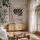 Modern Petals IV Neutral by Veronique Charron. Shown in a natural wood frame in a cozy modern living room. Available as an archival giclee rolled canvas, fine art paper, or poster print. SKU 89115a.