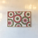 Otomi Holiday X by Veronique Charron. shown as a paper print in a natural frame. Available as a archival giclee rolled canvas, fine art paper, or poster print. SKU 45523i.