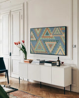 Outdoor Geo X by Veronique Charron. shown as a framed stretched canvas in a living room above a console. Available as a archival giclee rolled canvas, fine art paper, or poster print. SKU 36769i.