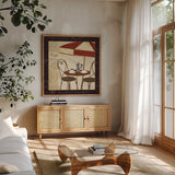 Petit Cafe I with Border by Veronique Charron. Shown in a natural wood frame in a cozy modern living room. Available as an archival giclee rolled canvas, fine art paper, or poster print. SKU 3285a.