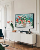 Snowy Fun I by Veronique Charron. shown as a framed stretched canvas in a living room above a console. Available as a archival giclee rolled canvas, fine art paper, or poster print. SKU 58168i.