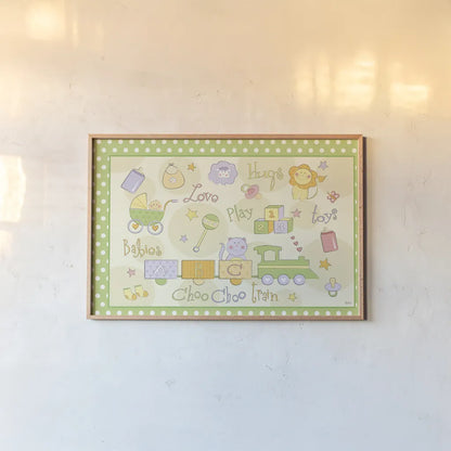 Toys and Hugs I Green by Veronique Charron. shown as a paper print in a natural frame. Available as a archival giclee rolled canvas, fine art paper, or poster print. SKU 101250i.