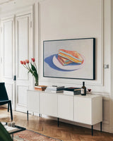 Cheesy by Wellington Studio. shown as a framed stretched canvas in a living room above a console. Available as a archival giclee rolled canvas, fine art paper, or poster print. SKU 90168i.